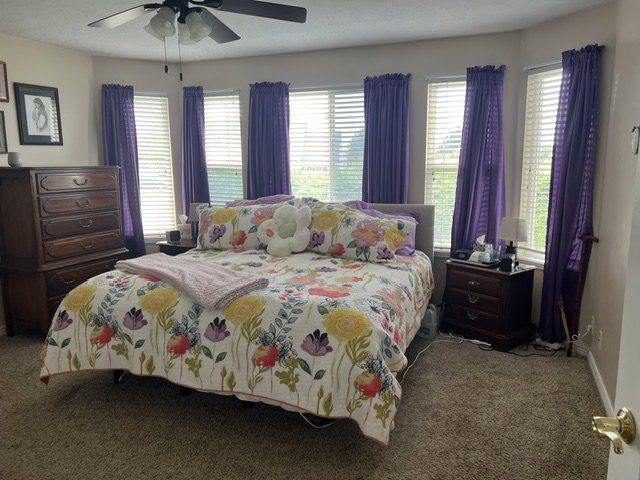 Spacious primary bedroom featuring a bay window.
