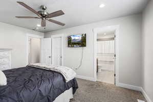Carpeted room with recessed lighting and a ceiling fan