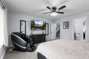 Wall-mounted television with contrasting black dresser below
