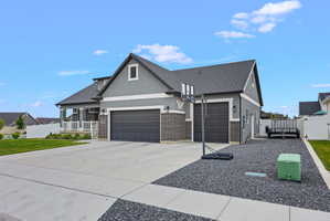 Contemporary stucco exterior with a covered porch featuring white railings