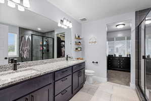 Dual vanity with granite-style countertop and undermount sinks