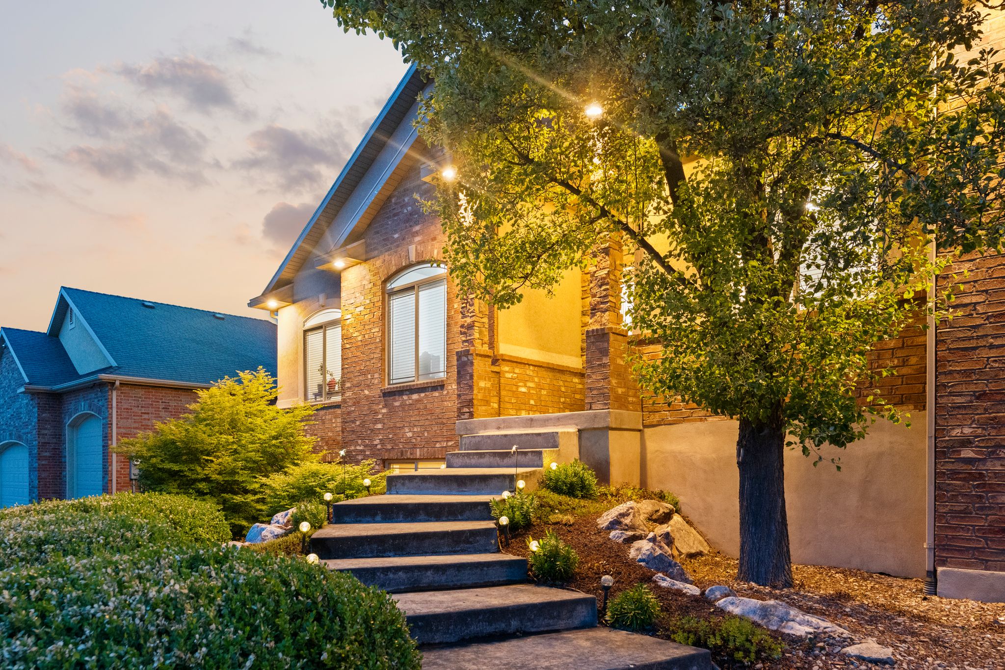 Brick exterior with stone accents and arched windows