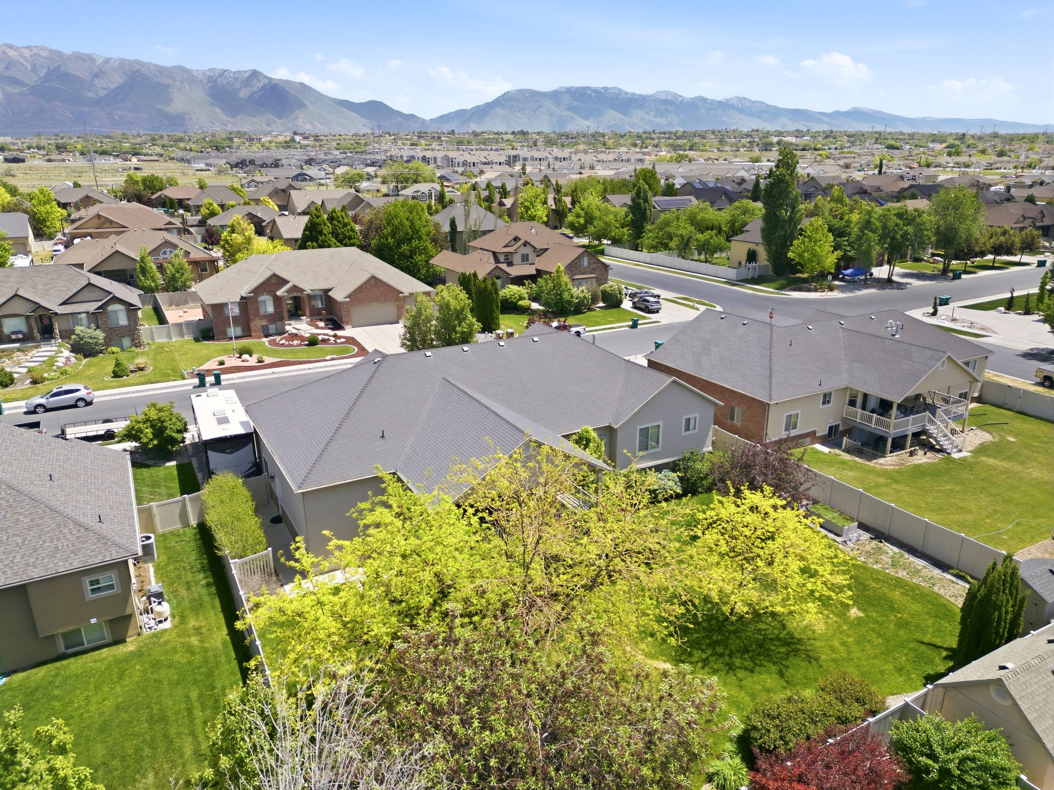 Expansive residential neighborhood featuring numerous single-family homes with pitched roofs and mature landscaping