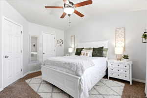 Vaulted ceiling with a wood-blade ceiling fan and integrated lighting