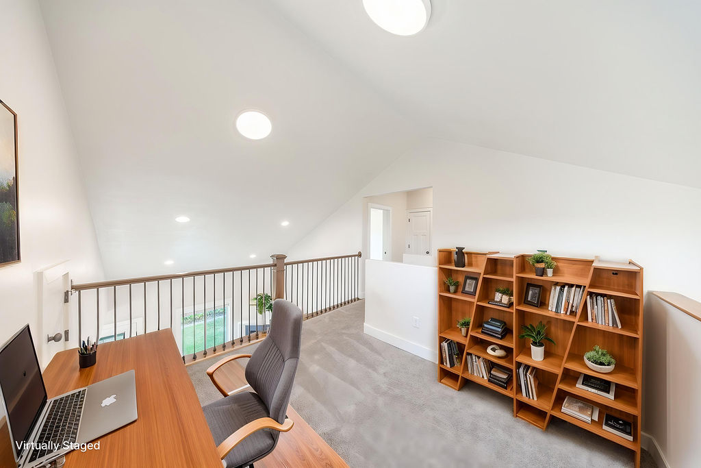 Loft area featuring vaulted ceilings and recessed lighting