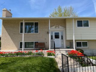 Classic brick and siding exterior with a welcoming covered front porch