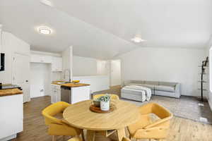 Open-concept living area with vaulted ceilings
