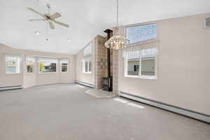 Spacious living area featuring a vaulted ceiling with recessed lighting and a ceiling fan