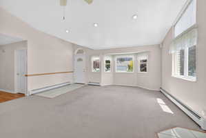 Light-filled entry area with a curved bay window and an arched transom window