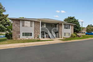 Two-story multi-unit structure featuring brick and siding exterior