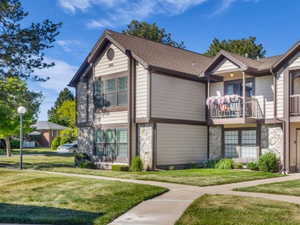 Multi-unit building featuring siding and stone veneer accents