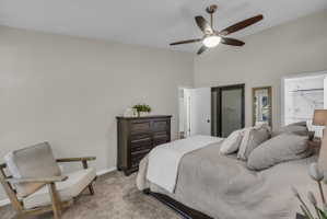 Vaulted ceiling featuring a contemporary ceiling fan with integrated lighting