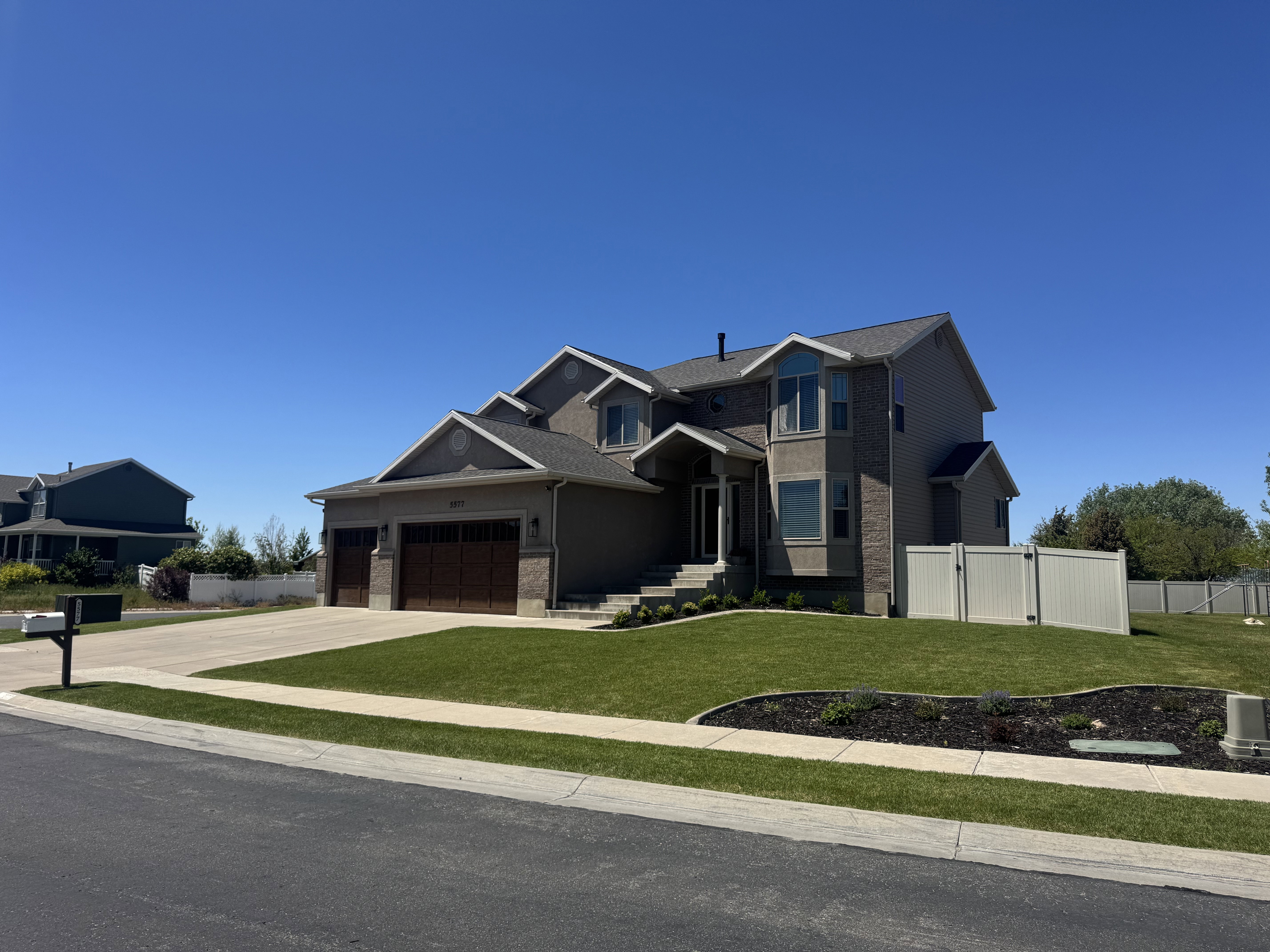 Contemporary two-story residence featuring a stone and stucco facade