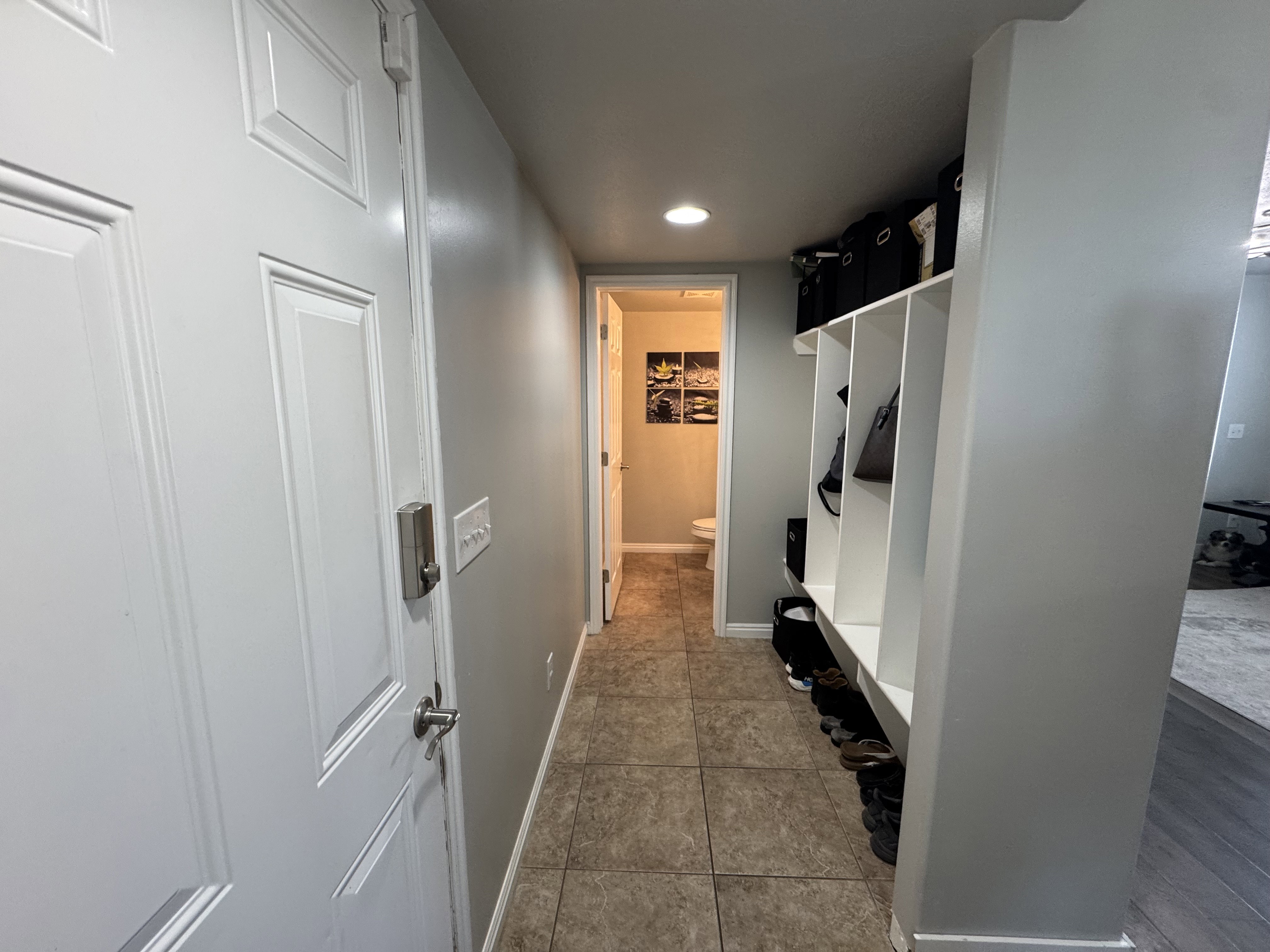 Entryway featuring tile flooring, built-in cubby storage, and recessed lighting