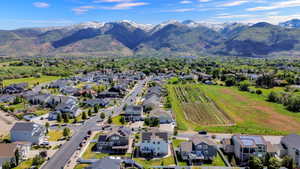 Expansive residential neighborhood featuring a mix of single-family homes, mature landscaping, and mountain backdrop