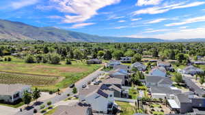 Aerial perspective showcasing a residential area with varied home styles, many featuring solar panels