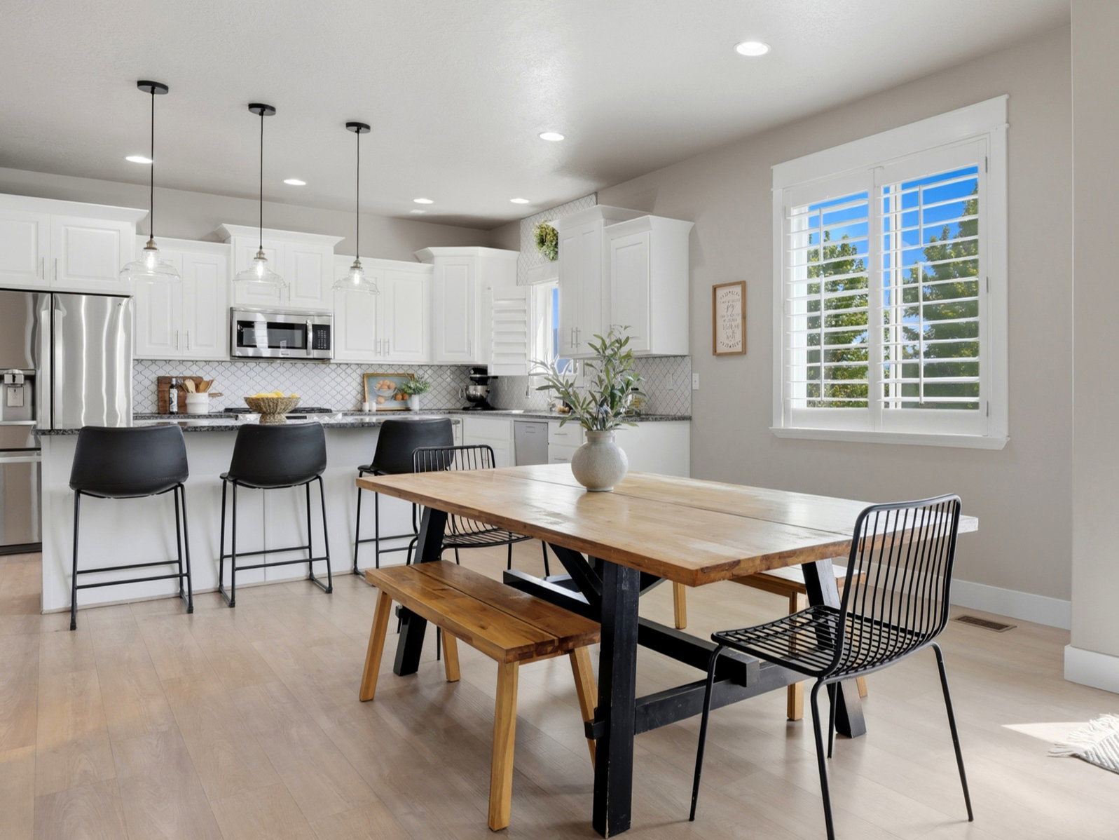 Open-concept living area featuring light wood-finish flooring