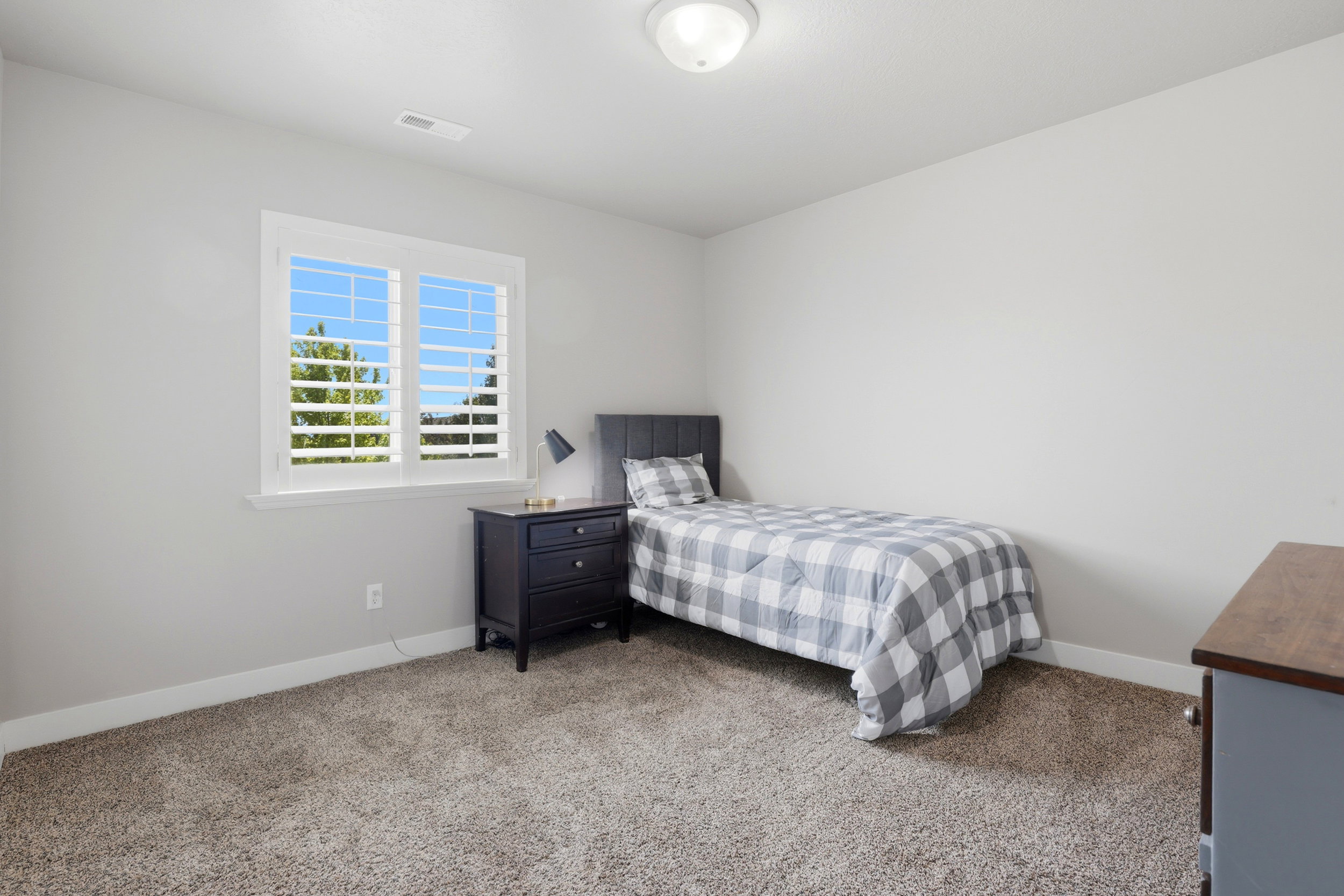 Soft gray walls and plush carpeting provide a neutral backdrop for any decor