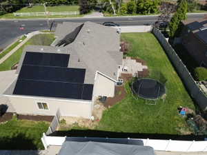 Contemporary residence featuring a pitched roof with extensive solar paneling