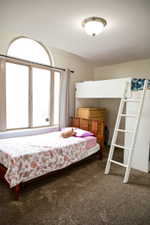 Tall windows with an arched transom provide abundant light