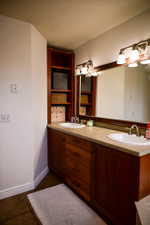 Double vanity with two integrated sinks and brushed nickel faucets