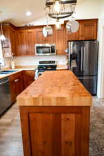 Kitchen island featuring a butcher block countertop
