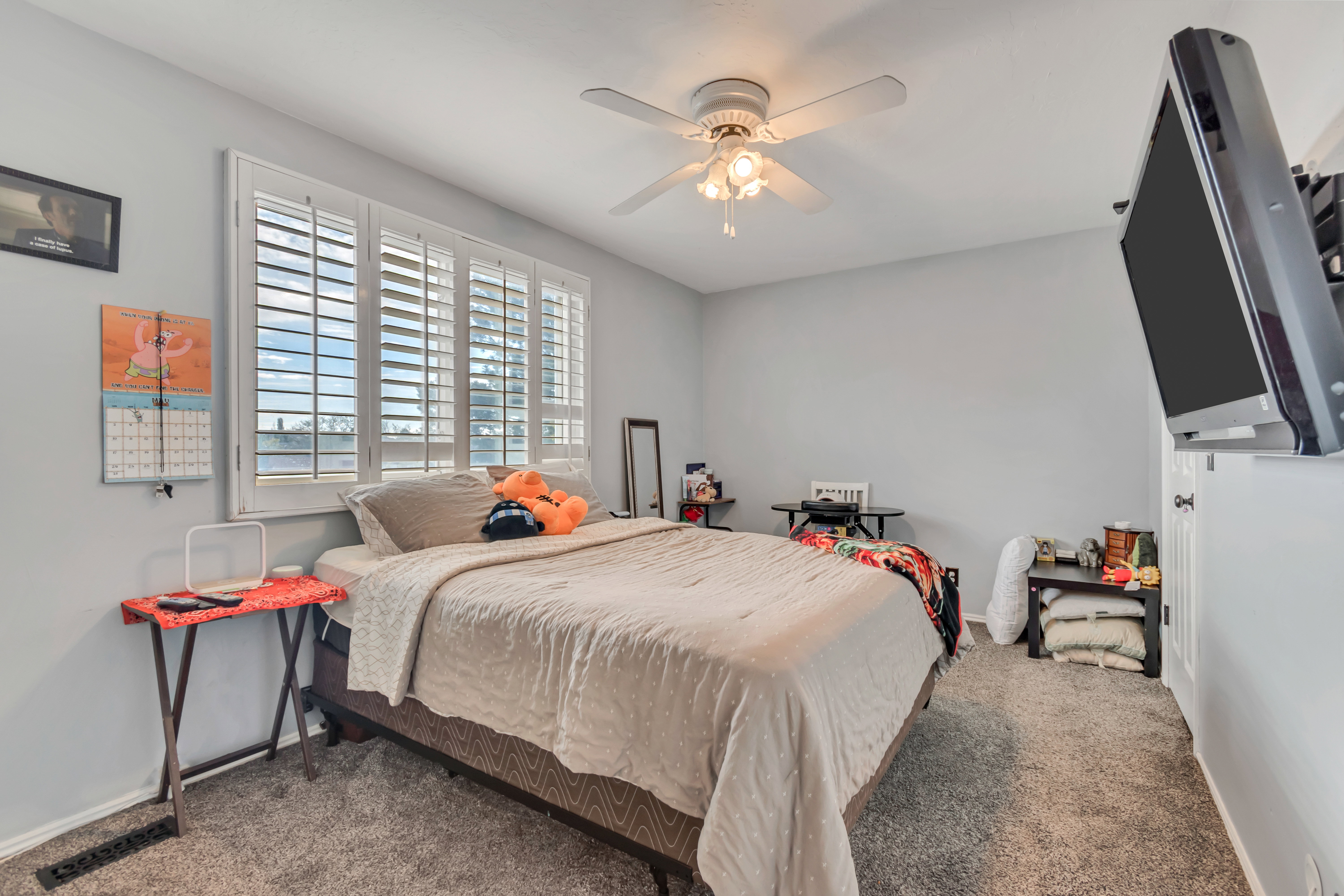 Bedroom featuring neutral wall paint and plush carpeting