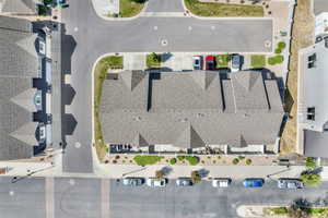 Townhome community with asphalt shingle roofs and integrated driveways
