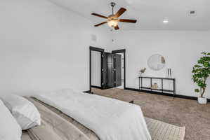 Vaulted ceiling featuring a ceiling fan with integrated lighting