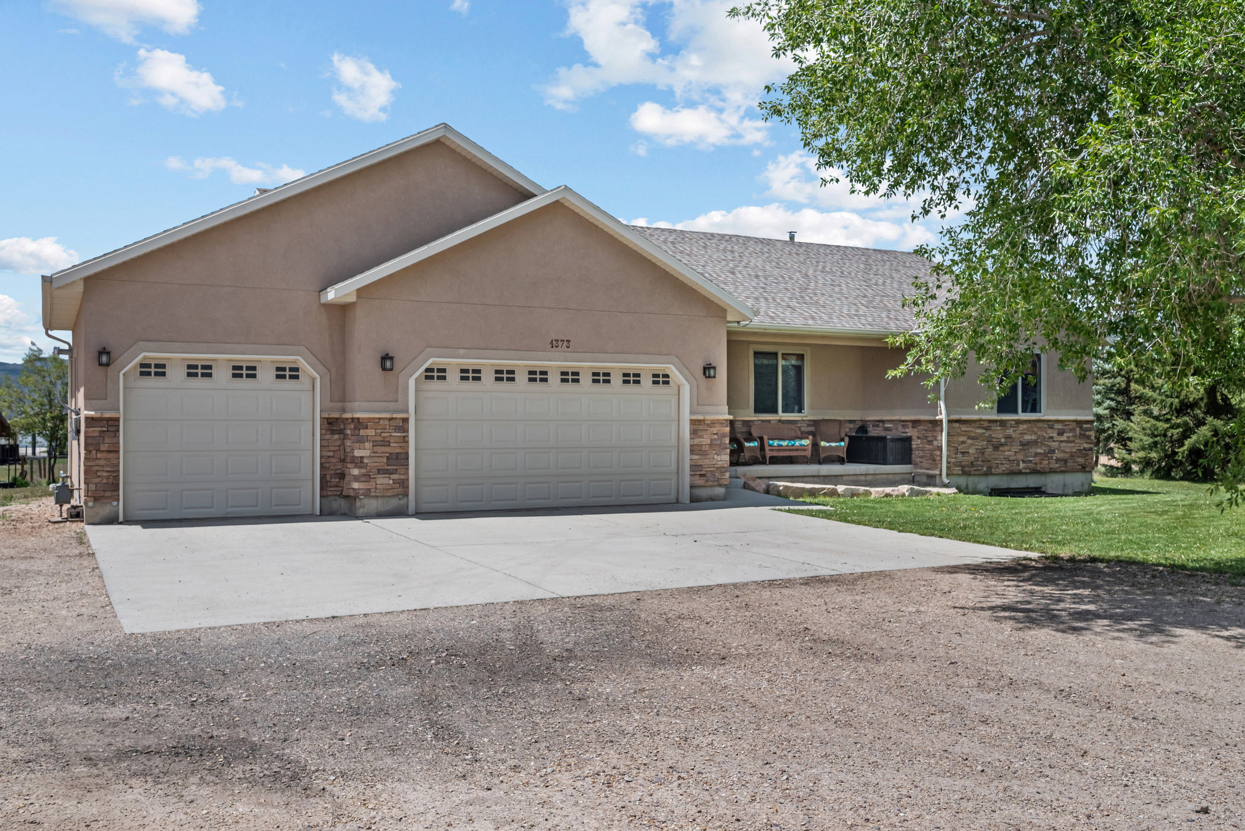 Stucco exterior with stone veneer accents