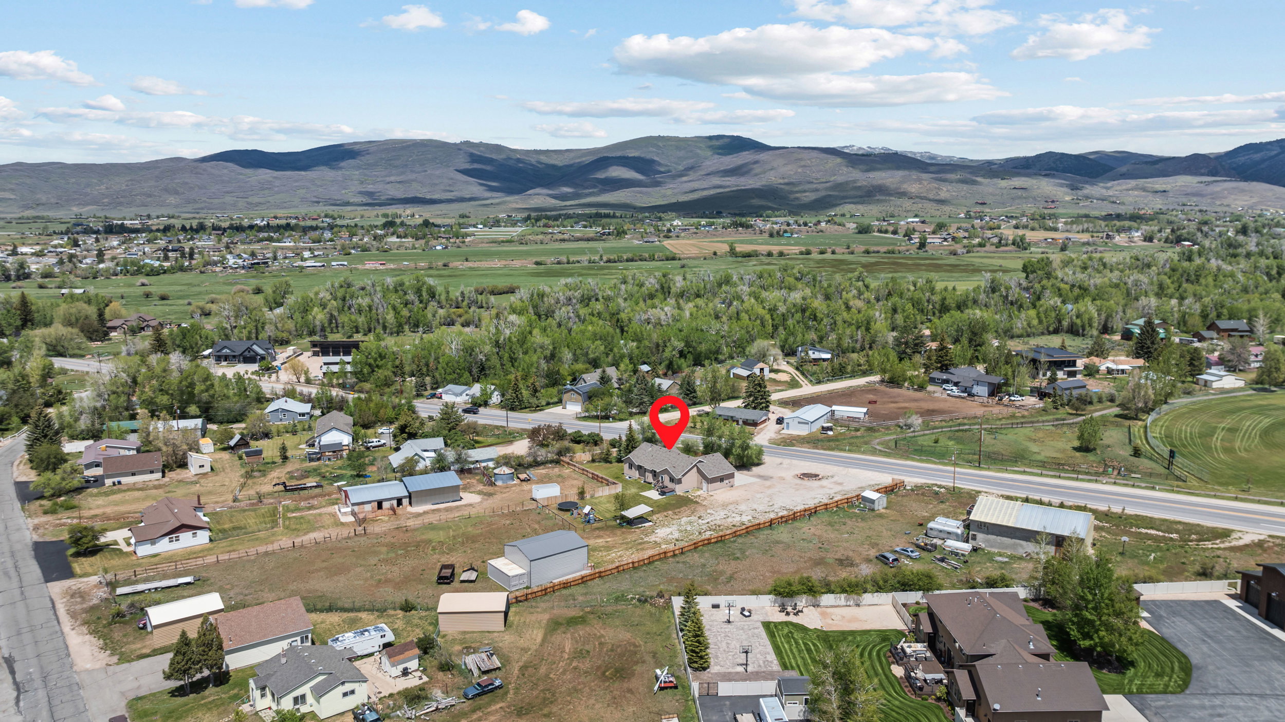 Expansive aerial perspective showcasing the property's prominent positioning within a rural landscape