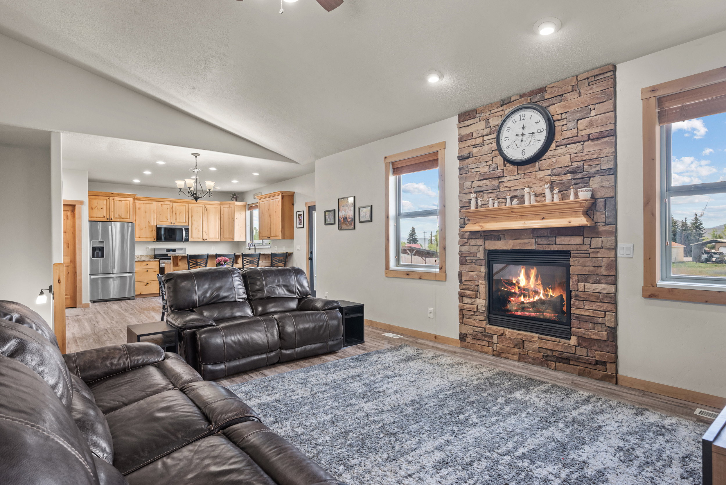 Stone-faced fireplace with a wood mantel