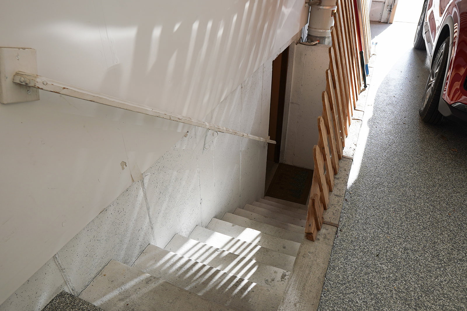 Stairs into basement from inside of garage