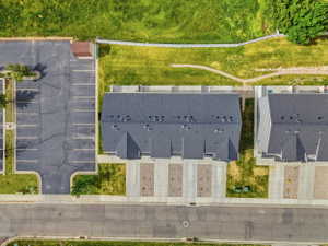 Aerial perspective showcasing new construction townhomes with dark shingle roofing