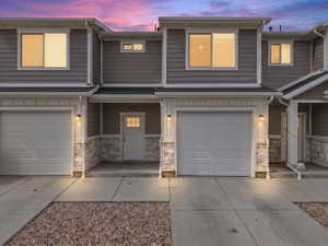 Modern gray siding exterior with stone accents