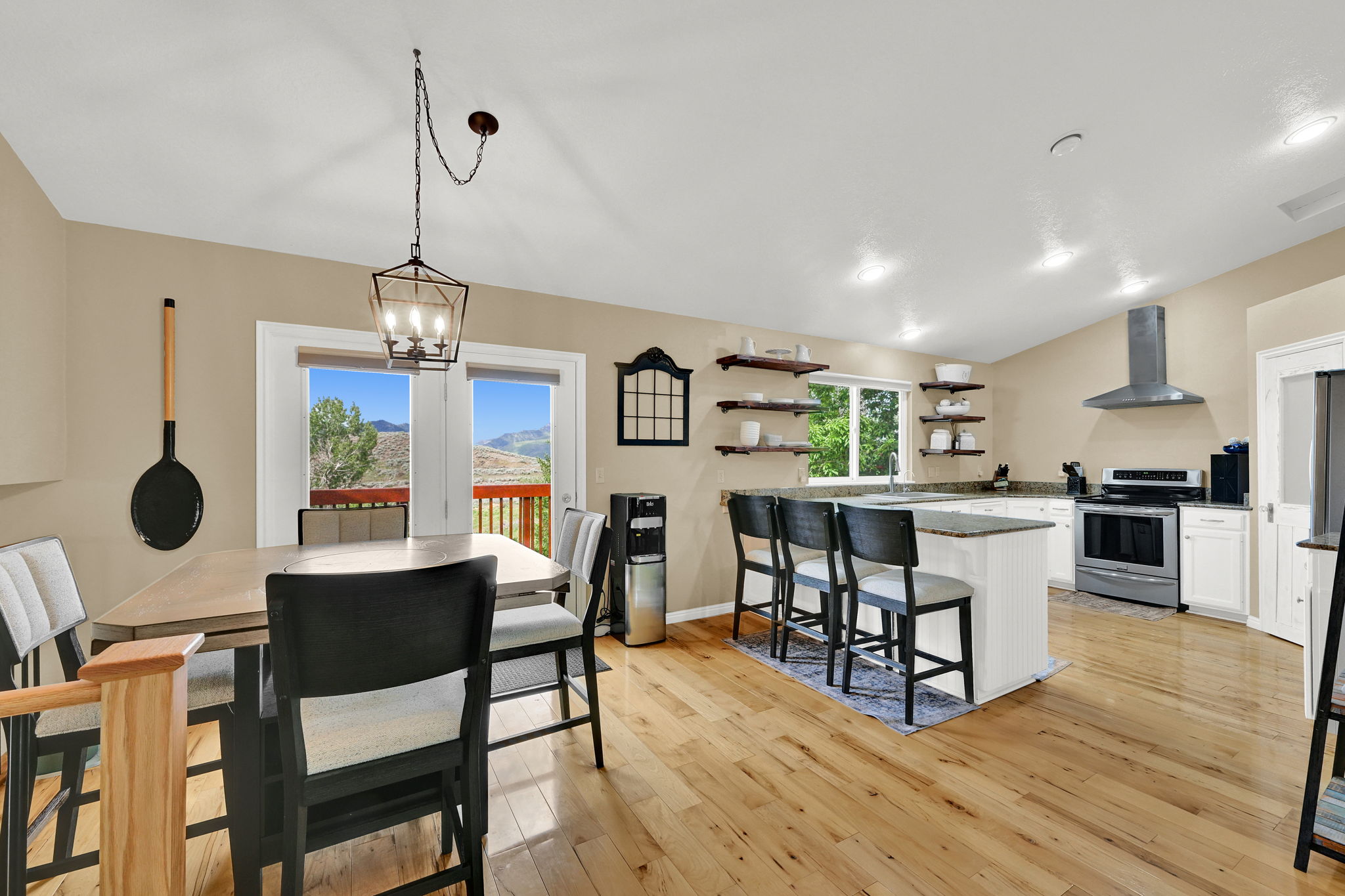 Open concept living area with wood-finish flooring