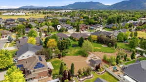 Expansive residential neighborhood with mature landscaping and mountain backdrop
