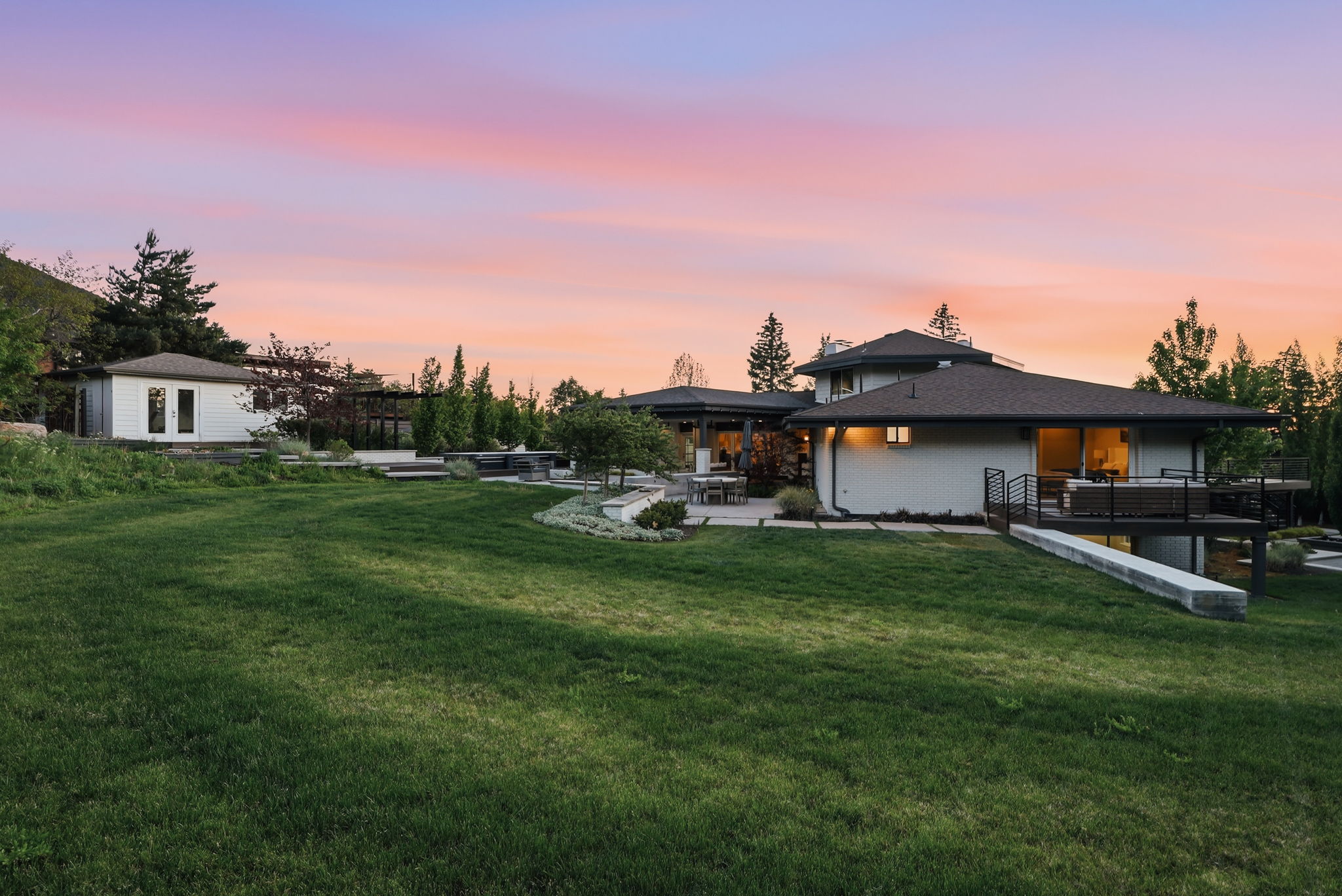 Expansive terraced lawn and landscaping surrounding a contemporary residence
