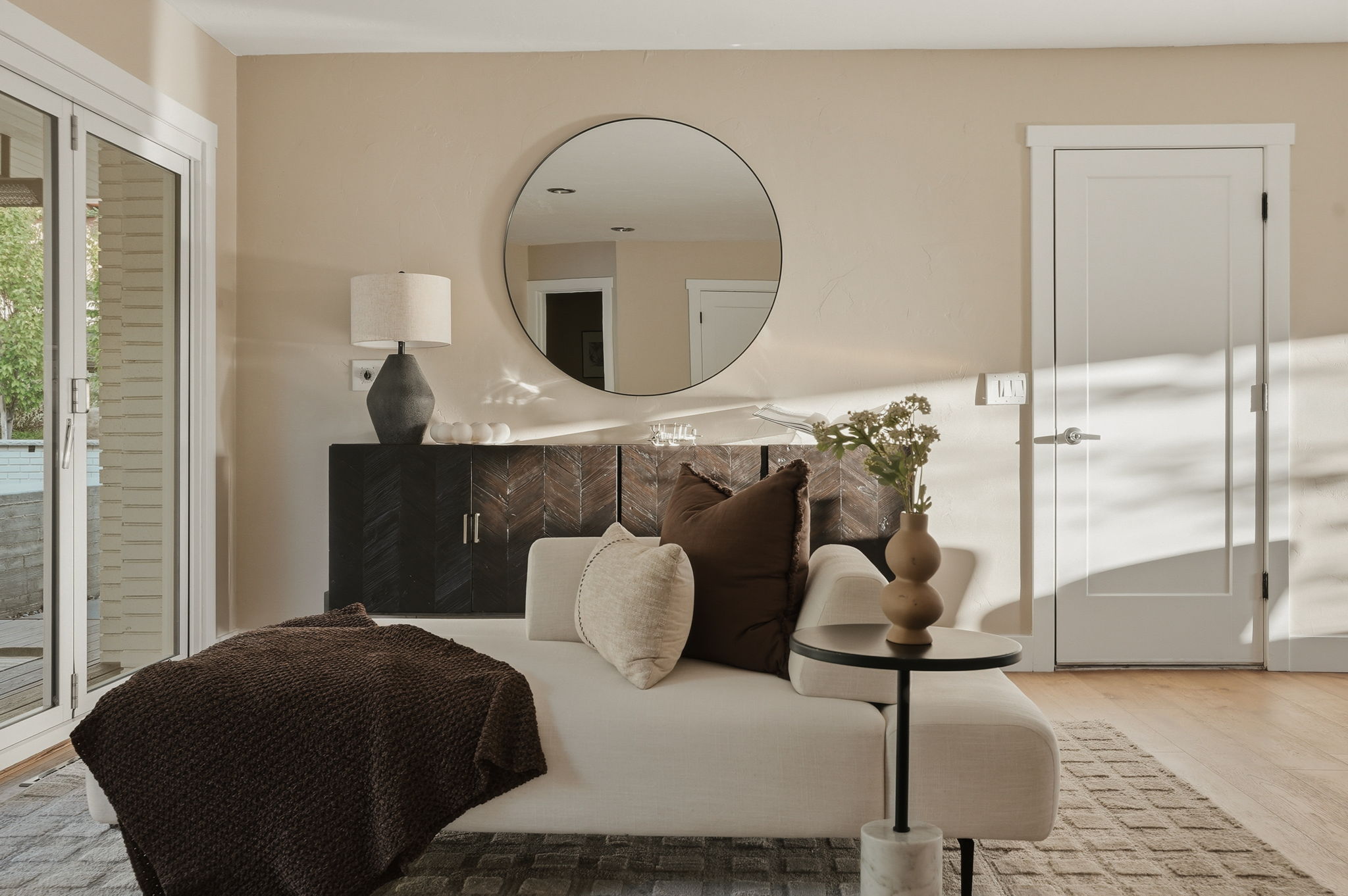 Light-toned wall finishes complement the wood-finish flooring