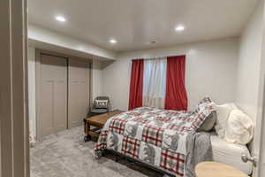 Neutral wall paint, recessed lighting, and grey carpet flooring