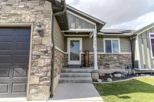 Stone veneer facade with board and batten siding