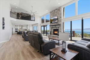Grand living space with soaring ceilings and expansive windows, offering abundant natural light