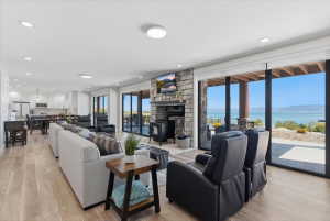 Open-concept living space featuring wood-finish flooring and recessed lighting