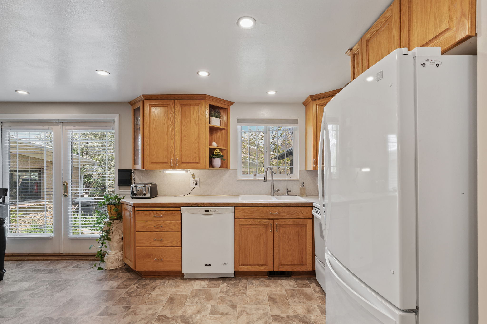 Kitchen/Dining. Can Lights! Updated flooring. Natural Light. Access to back deck. Access to attached garage/workshop.