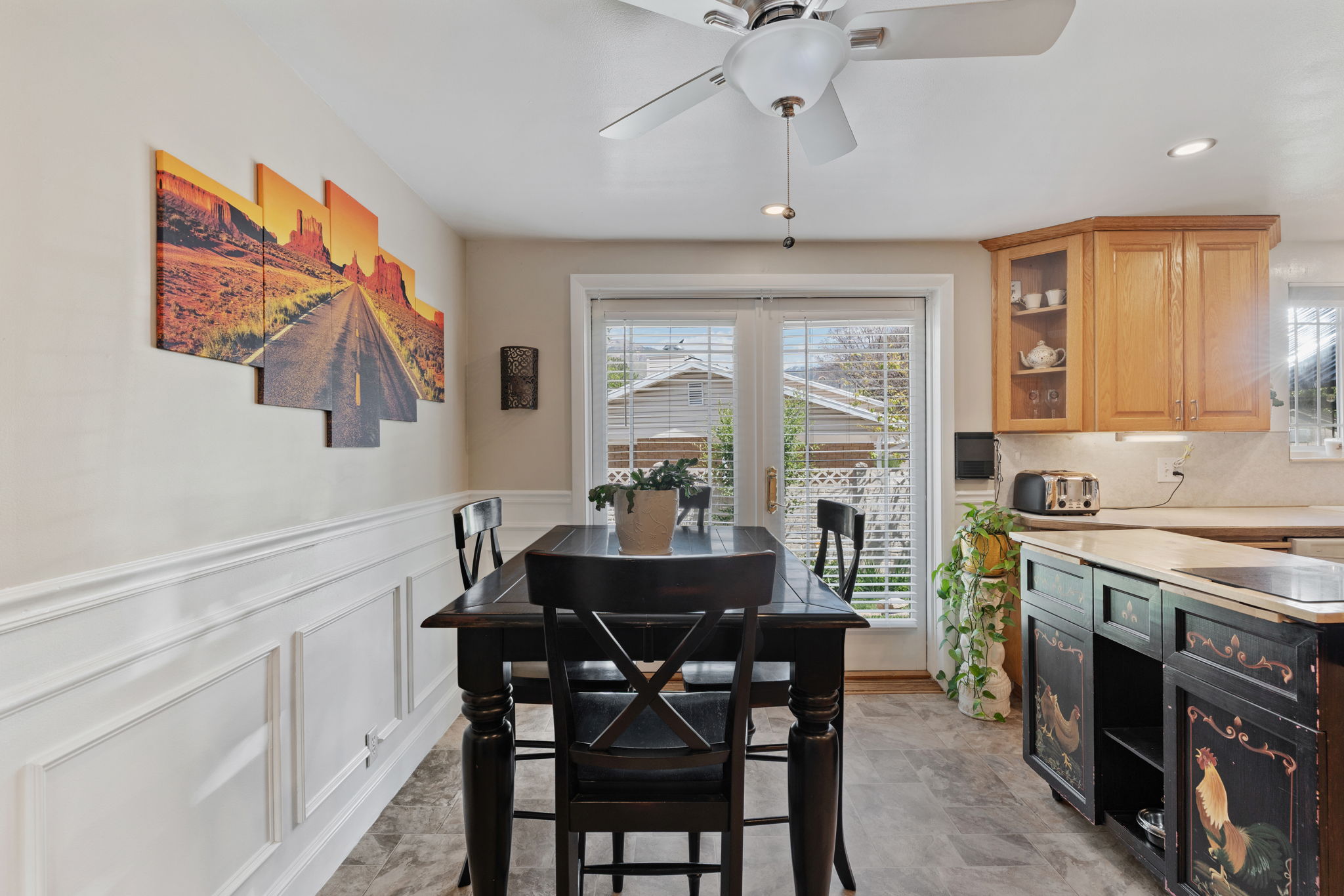Kitchen/Dining. Can Lights! Updated flooring. Natural Light. Access to back deck. Access to attached garage/workshop.