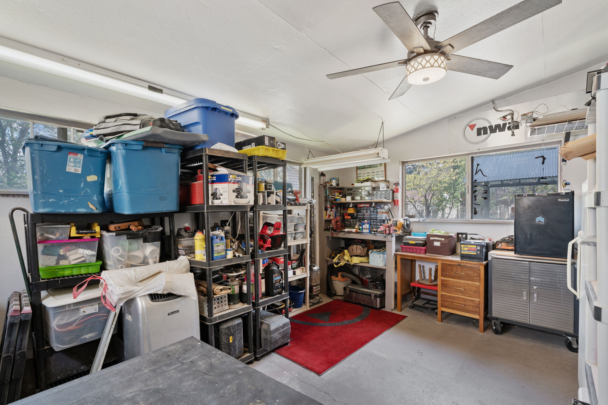 14'x18' Wood/Work Shop on the backside of the garage! Has (3) 220V Outlets.