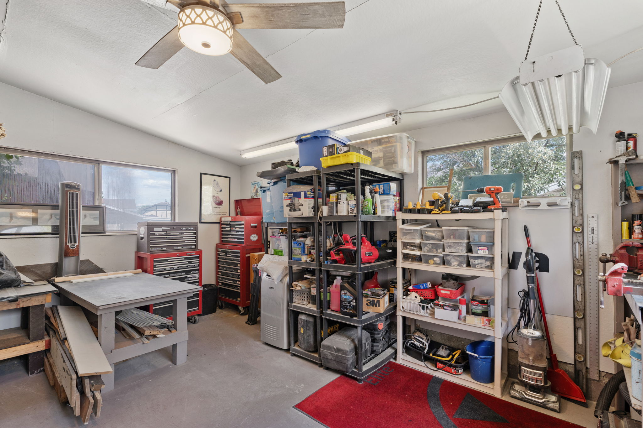 14'x18' Wood/Work Shop on the backside of the garage! Has (3) 220V Outlets.