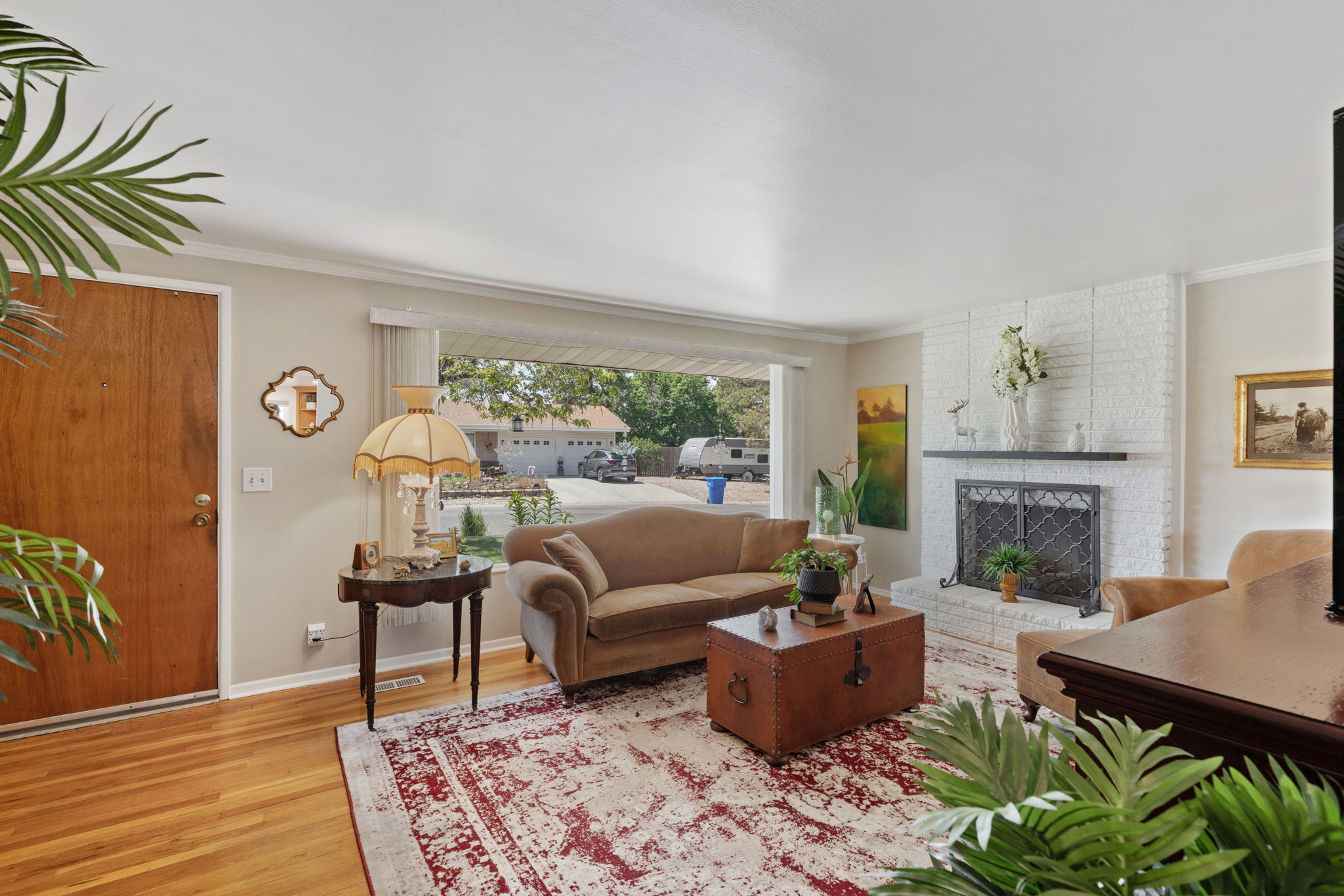 Front Living Room! Fire Place. Expansive Window. Original Hardwood Flooring!