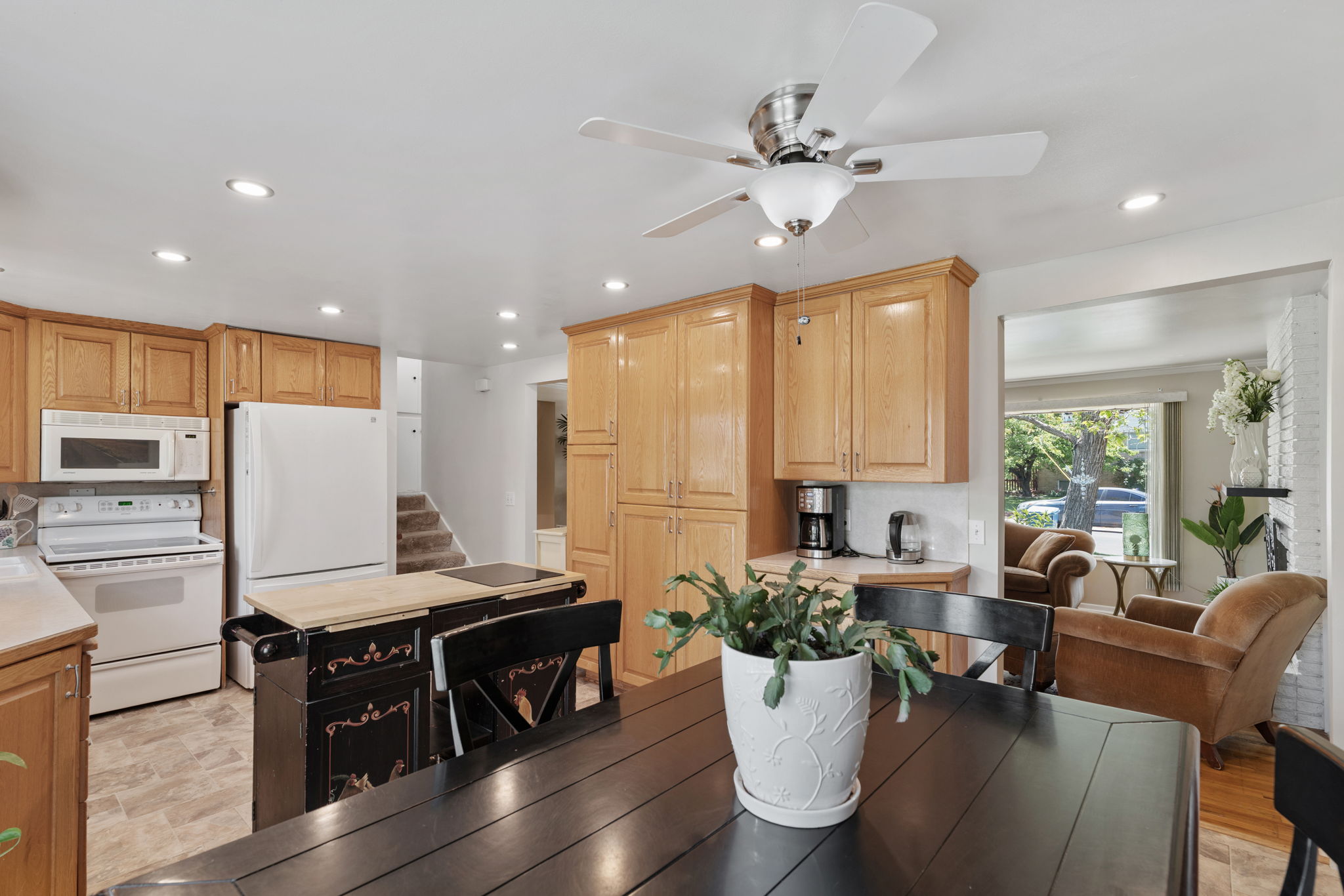 Kitchen/Dining. Can Lights! Updated flooring. Natural Light. Access to back deck. Access to attached garage/workshop.