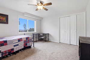 Room featuring a large window, light-colored carpeting, and white walls